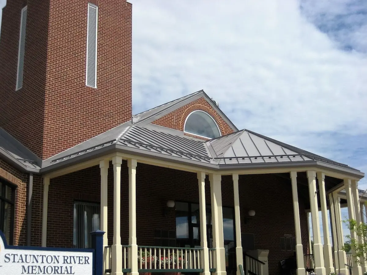 Skilled roofing craftsmen working on a residential roof in Long Point